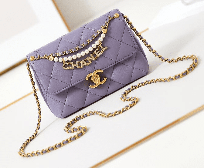 Chanel Shiny Lambskin Quilted Mini Pearl Logo Flap Light Purple